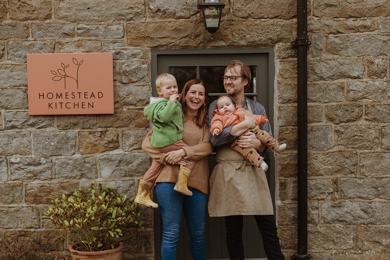 Peter Neville and his partner Cecily Fearnley with their children outside their restaurant Homestead Kitchen in Goathland, North Yorkshire - The Good Food Guide's Best Local Restaurant in the North East of England 2023.